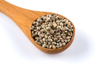 Cannabis Hemp seeds in spoon on white
