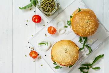 Arabic cuisine. Ramadan food. Homemade vegetarian mung cutlets burger on white a wooden kitchen table. Top view flat lay background, copy space.