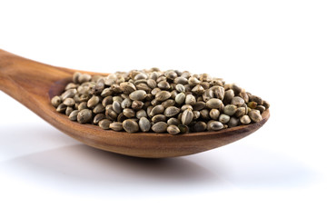 Cannabis Hemp seeds in spoon on white
