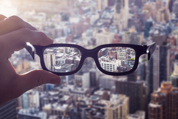 Hand glasses cityscape