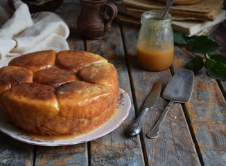 Caramel monkey bread. Apple pie with brown sugar and cinnamon on a wooden background. Autumn baking. Homemade sweets. Rustic style. Copy space.