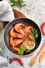 Fried big shrimps in tomato sauce with olive oil, garlic, ginger, chili and soy sauce