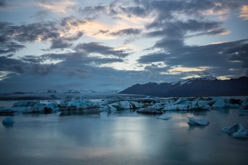 Iceland - Night over glacier lagoon joekulsarlon with moving ice floes