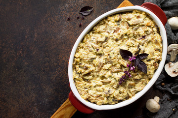 Baked potatoes with mushrooms and cheese on thanksgiving dinner table. Copy space.