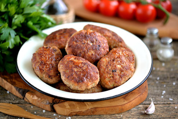 Homemade cutlets from minced pork and beef. Rustic food.