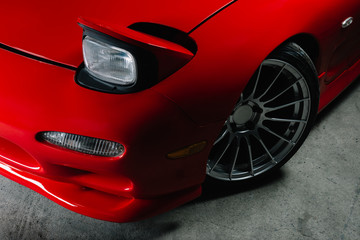 Fototapeta na wymiar Car detailing series: Closeup of clean red sports car