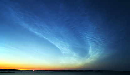 Fototapeta na wymiar Noctilucent clouds over Onego lake, Petrozavodsk, Russia.