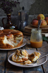 Caramel monkey bread. Apple pie with brown sugar and cinnamon on a wooden background. Autumn baking. Homemade sweets. Rustic style. Copy space.