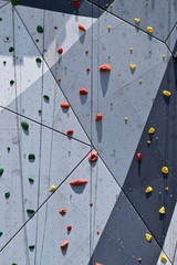 climbing wall outdoor with colored grips