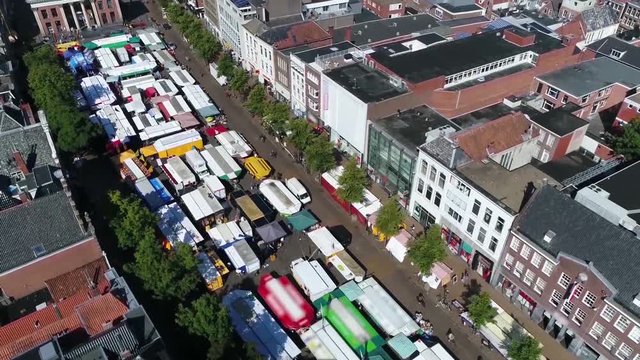 Aerial footage of market located at shopping street a marketplace is a location where people regularly gather for the purchase and sale of provisions livestock and other goods 4k high resolution