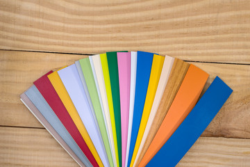 Plastic coloured sampler for furniture on wooden desk