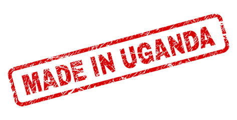 MADE IN UGANDA stamp seal print with grunge style. Red vector rubber print of MADE IN UGANDA text with retro texture. Text title is placed inside rounded rectangle frame.