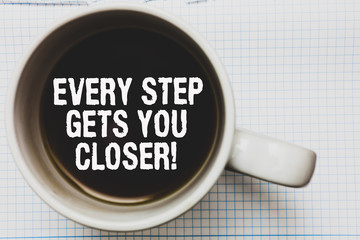 Writing note showing Every Step Gets You Closer. Business photo showcasing Keep moving to reach your goals objectives Coffee mug with black coffee floating some white texts on white paper.