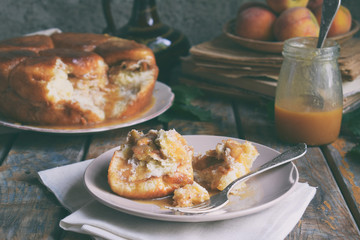 Caramel monkey bread. Apple pie with brown sugar and cinnamon on a wooden background. Autumn baking. Homemade sweets. Rustic style. Copy space.