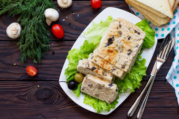 Thanksgiving Turkey dinner. Cupcake casserole with turkey meat and mushrooms on a wooden table. The concept of food on thanksgiving. Top view flat lay background.
