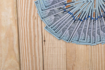 us dollar on wooden desk. clsoe up