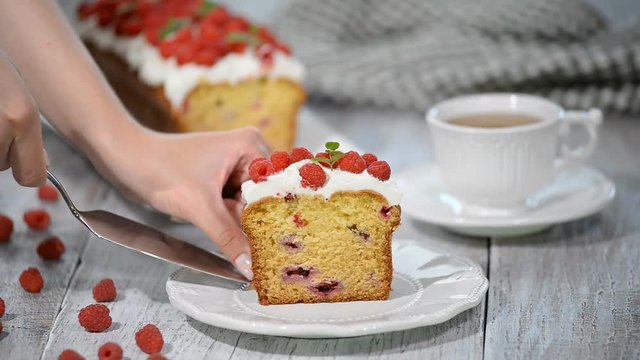 Cake with raspberries and mint leaves.