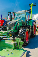 modern tractor for agriculture on the farm with a powerful motor, the flagship of the modern agricultural industry