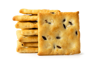 Cookie cracker with sesame and flax seeds on a white, isolated.