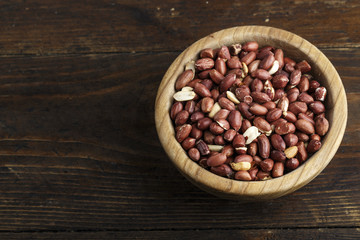 peanuts in a wooden plate