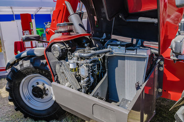 modern tractor for agriculture on the farm with a powerful motor, the flagship of the modern agricultural industry