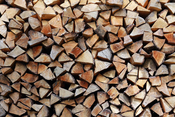 Firewoods stack at the wall background with a text space design pattern