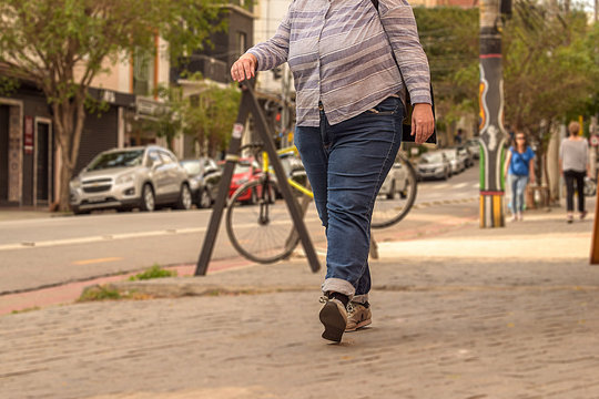 Obese Woman Walking Alone