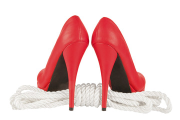 Red high heels and rope isolated on white background. Bondage concept.