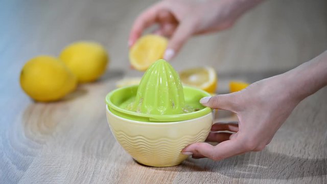 Squeezing lemon juice. Lemon fruit