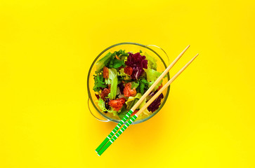 Salmon Poke Salad on yellow background . Homemade food. The concept of healthy diet, copy space,...
