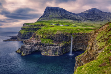 Fototapeta premium Gasadalur village and Beautiful waterfall, Vagar, Faroe Islands, Denmark.
