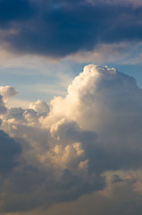 Landscape with dramatic light - beautiful golden sunset with saturated sky and clouds.