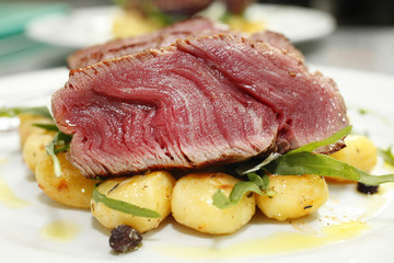 Fillet Mignon Beef Steak cooked rare with potato.