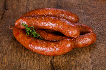 Pork sausages over wooden