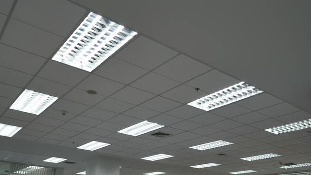 interior light in modern office with smoke sensor and emergency fire extinguisher sprinkler on ceiling roof