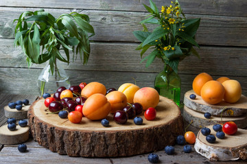 Fruits and berries on a stump.