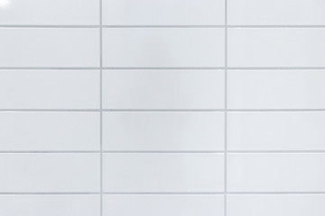 white tiles on bathroom wall