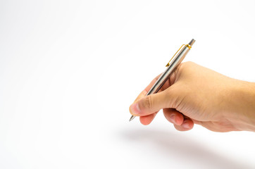 A man's hand holds a pen on a white background. The man writes with a pen. The man puts a signature...