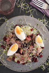 Marinated herring with eggs and vegetables salad