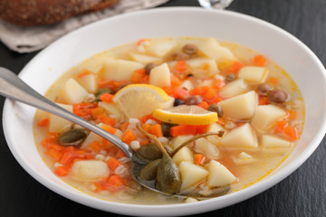 Rassolnik with capers and lemon