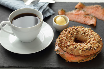 Salmon bagel sandwich and coffee
