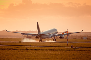 Fototapeta na wymiar Commercial airplane landing on international airport.