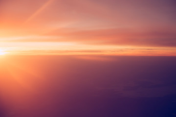 Naklejka na ściany i meble Sunrise sky from the airplane window