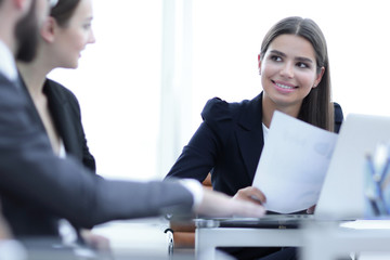 business partners discussing documents and ideas at meeting