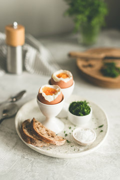 Boiled eggs in egg cups for breakfast