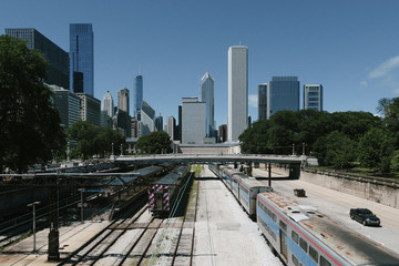Obraz na płótnie Canvas Skyscrapers over trains and train tracks in Chicago, USA