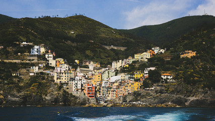 Fototapeta na wymiar Village of Riomaggiore viewed from the sea, in Cinque Terre, Italy