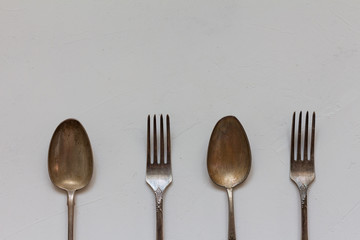 Vintage cutlery in a row. Top view