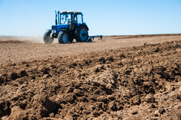 Fototapeta premium Agriculture with a tractor