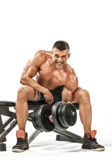 Brutal strong muscular bodybuilder athletic man pumping up muscles on white background. Workout bodybuilding concept. Copy space for sport nutrition ads.